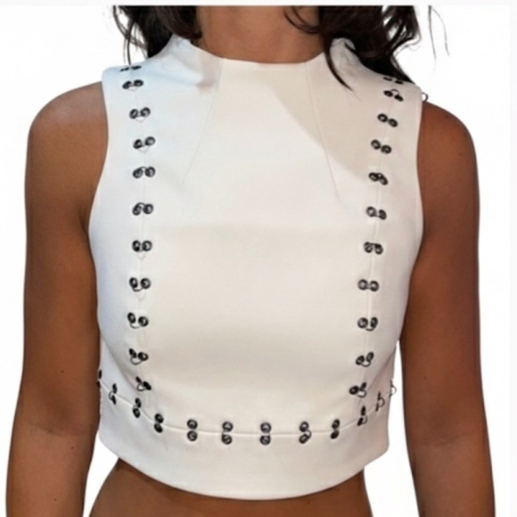 Topshop Tops - Topshop Cream Structured Crop
Top with Silver Eyelet Detailing Size 6 Like New!